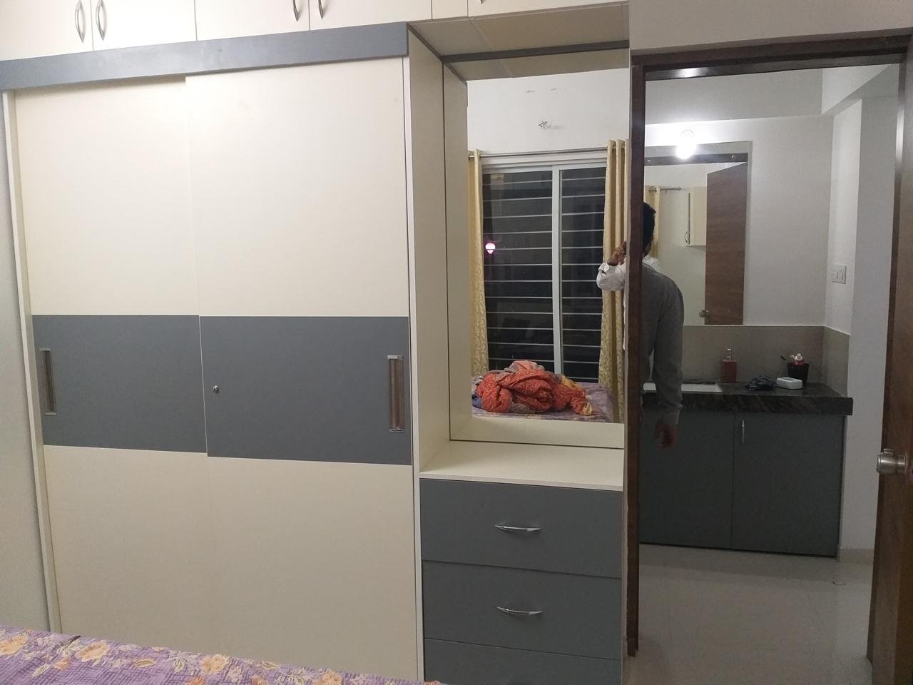Cream and grey sliding wardrobe with a dresser unit