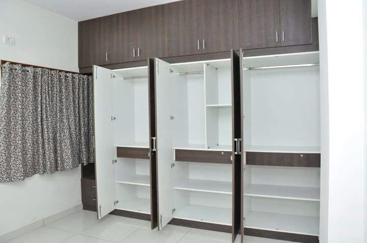 Opened wardrobe with hanging space and shelving