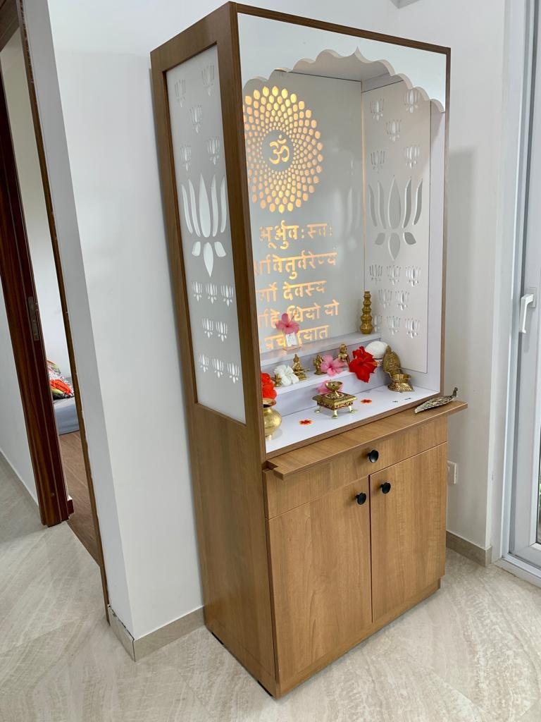 Inside of a three-door wardrobe showing hanging space, open shelving and pull-out drawers